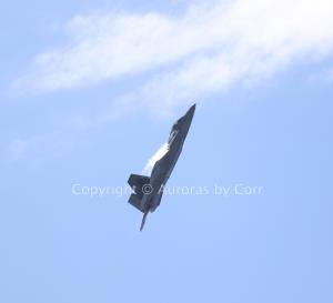 F-22 Raptor Climbing into the Skies with Vapour - Photographic Print